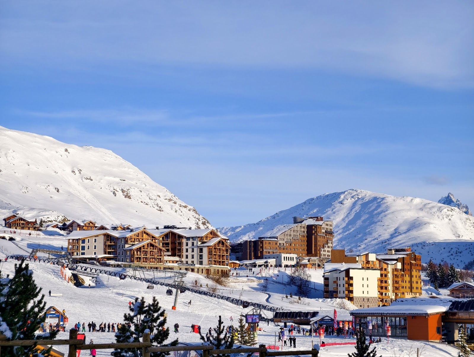 The sunny plateau of Alpe d Huez under clear winter sky