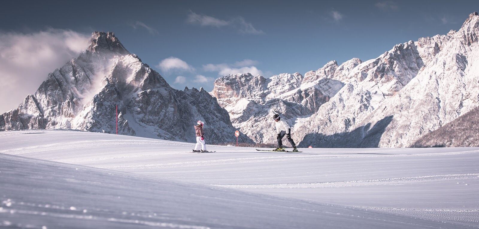 A chairlift rising over snowy slopes in the Alta Pusteria valley