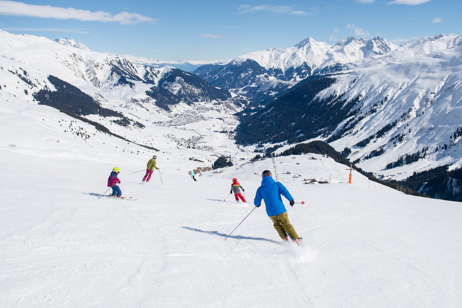 Skiers on a steep off piste descent at Andermatt