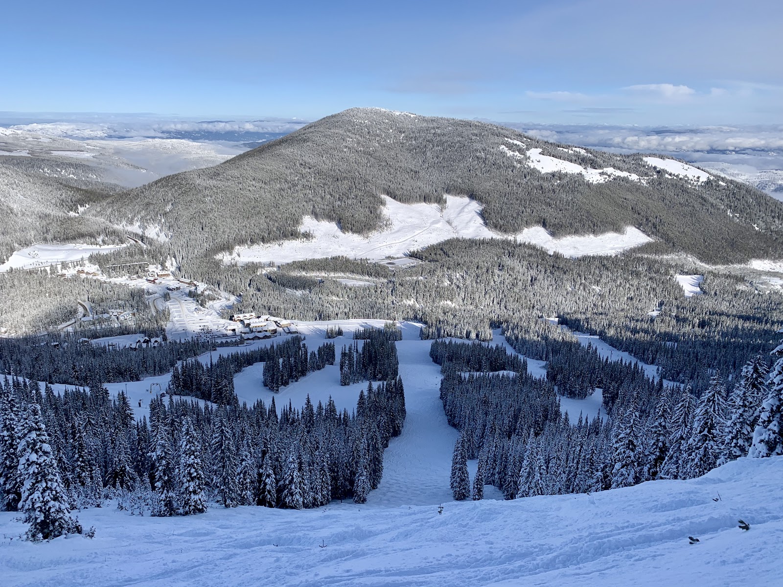 Empty groomed runs through the trees at Apex Mountain