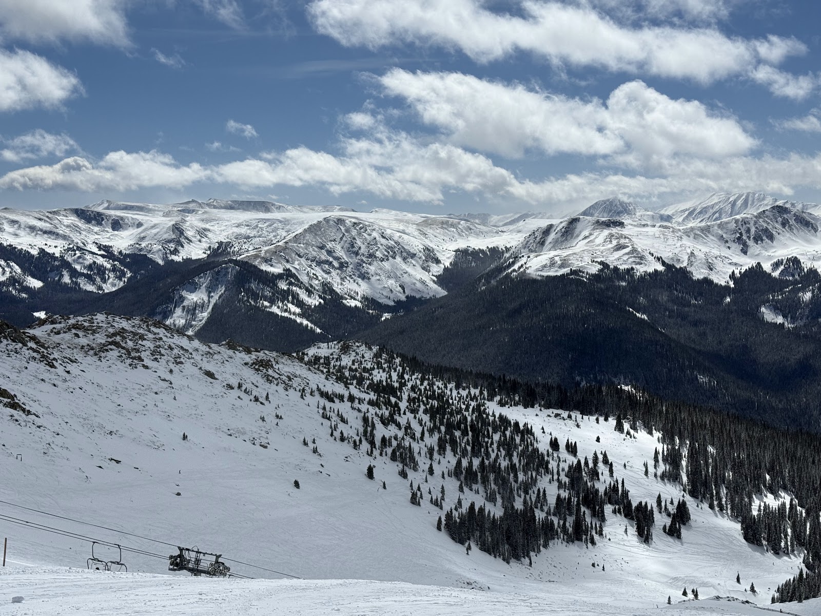 A skier carving deep powder in the North American Rockies