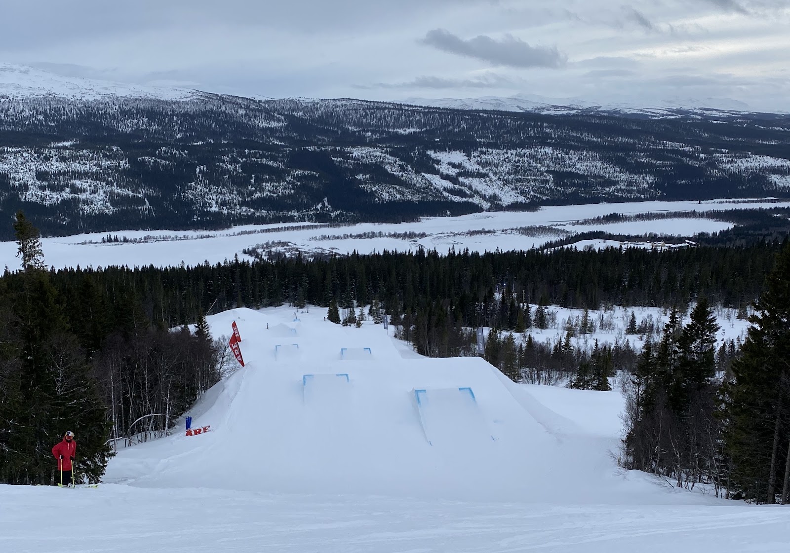 Tree lined runs and a chairlift at the Are base