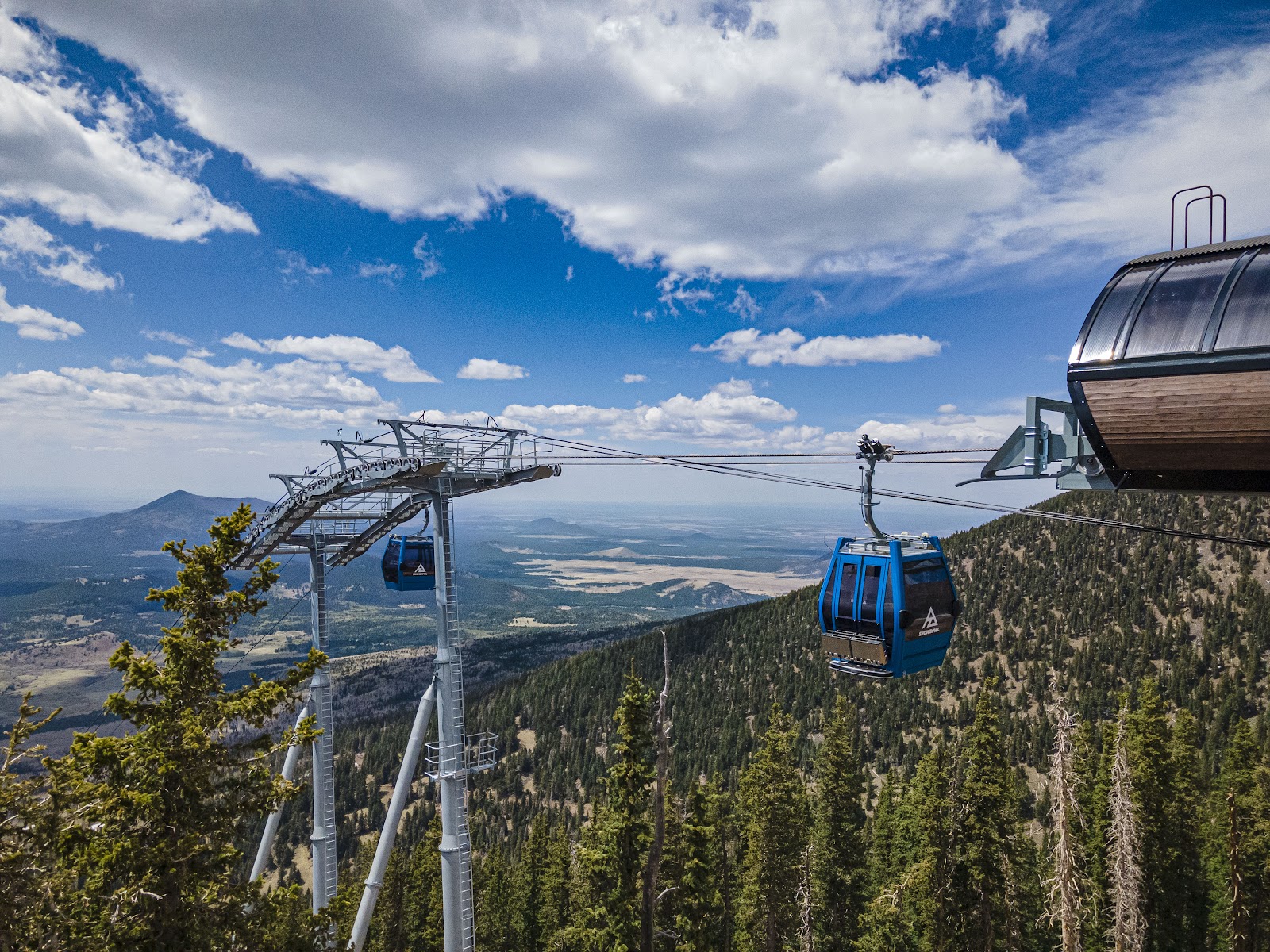High desert ski mountain under blue sky on the San Francisco Peaks