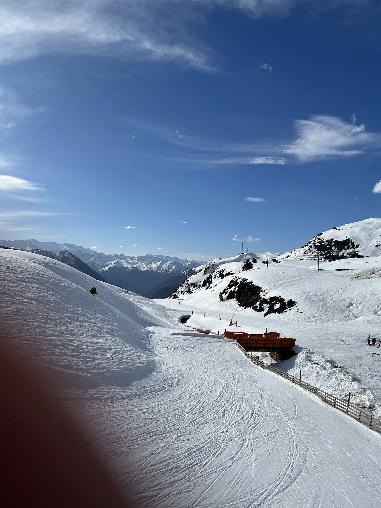 The base area and lifts at Baqueira Beret under blue skies