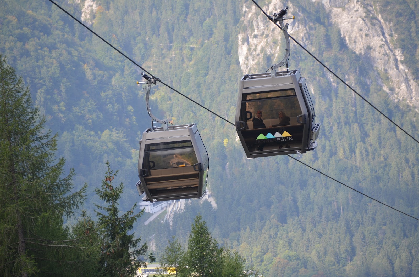 Modern gondola cabins climbing the snowy Jenner mountainside