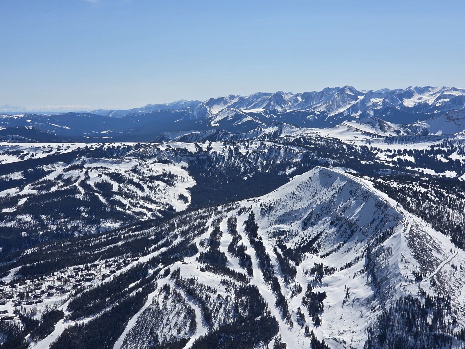 Snow covered slopes and the Mountain Village base area