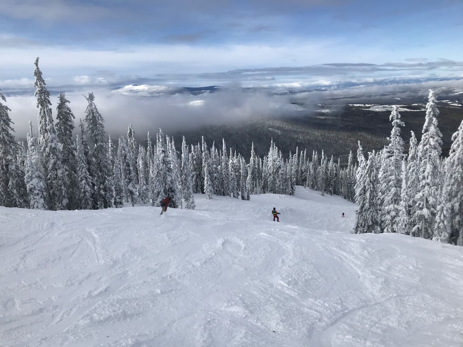 Snow covered runs and the ski in ski out village at Big White