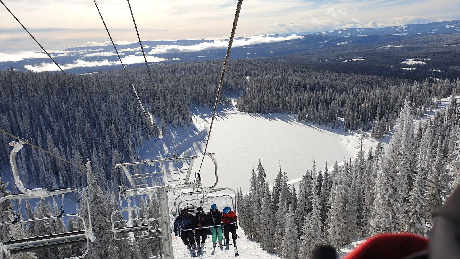 Families skiing gentle groomed terrain at Big White