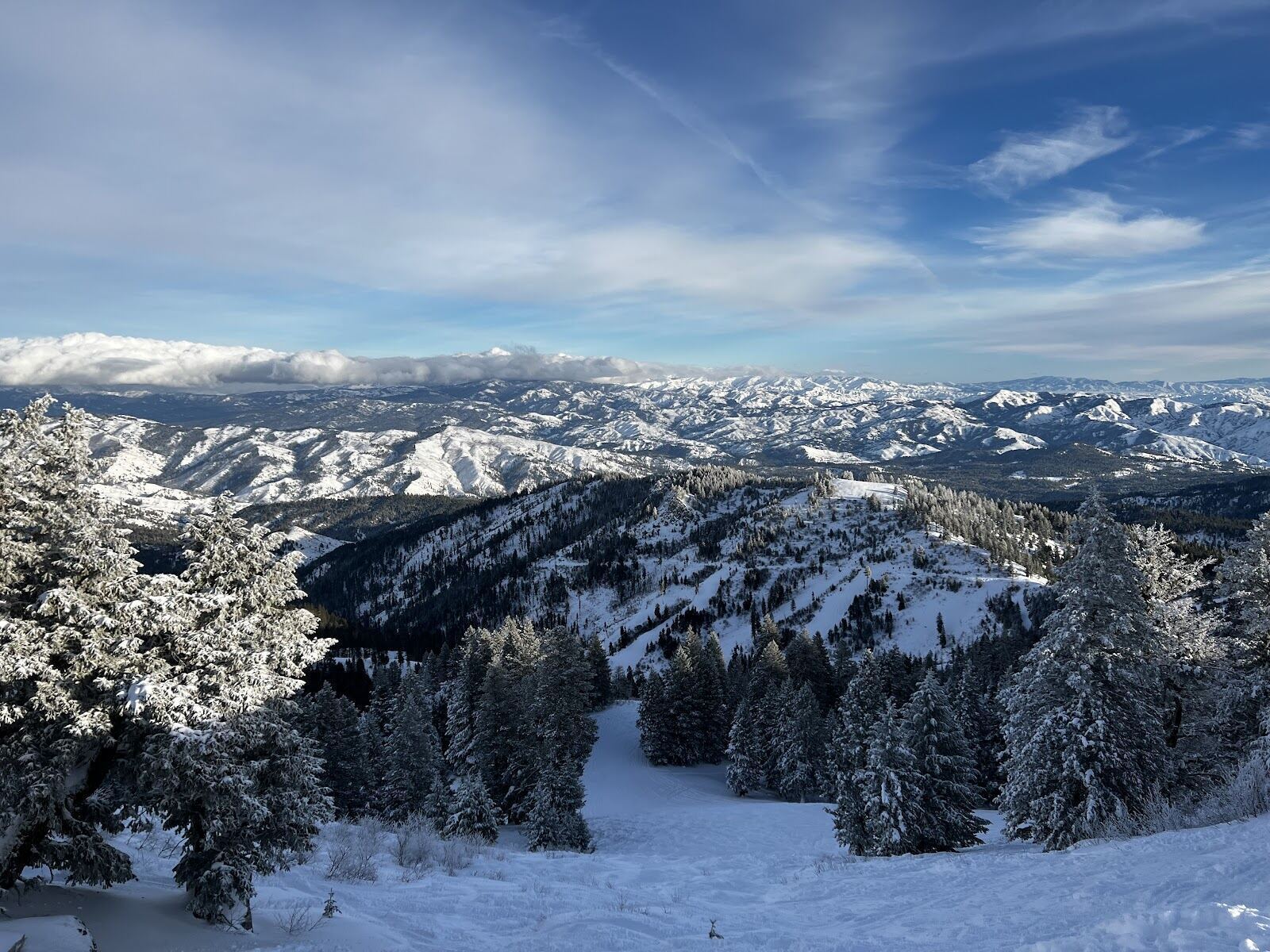Skiers on a groomed run at Bogus Basin