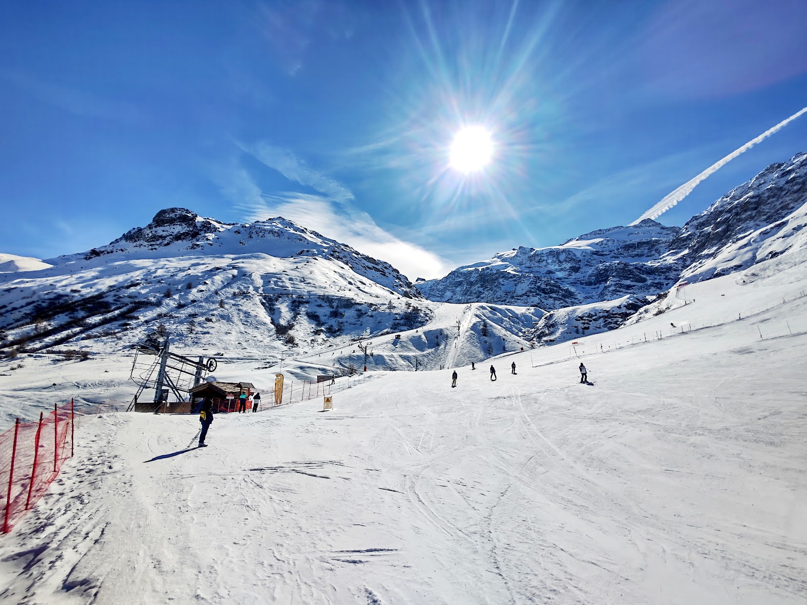 A skier on a quiet high run above Bonneval sur Arc in cold light