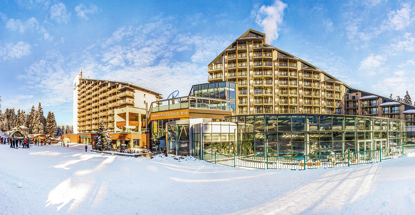 Snowy tree lined pistes above the base village at Borovets in Bulgaria