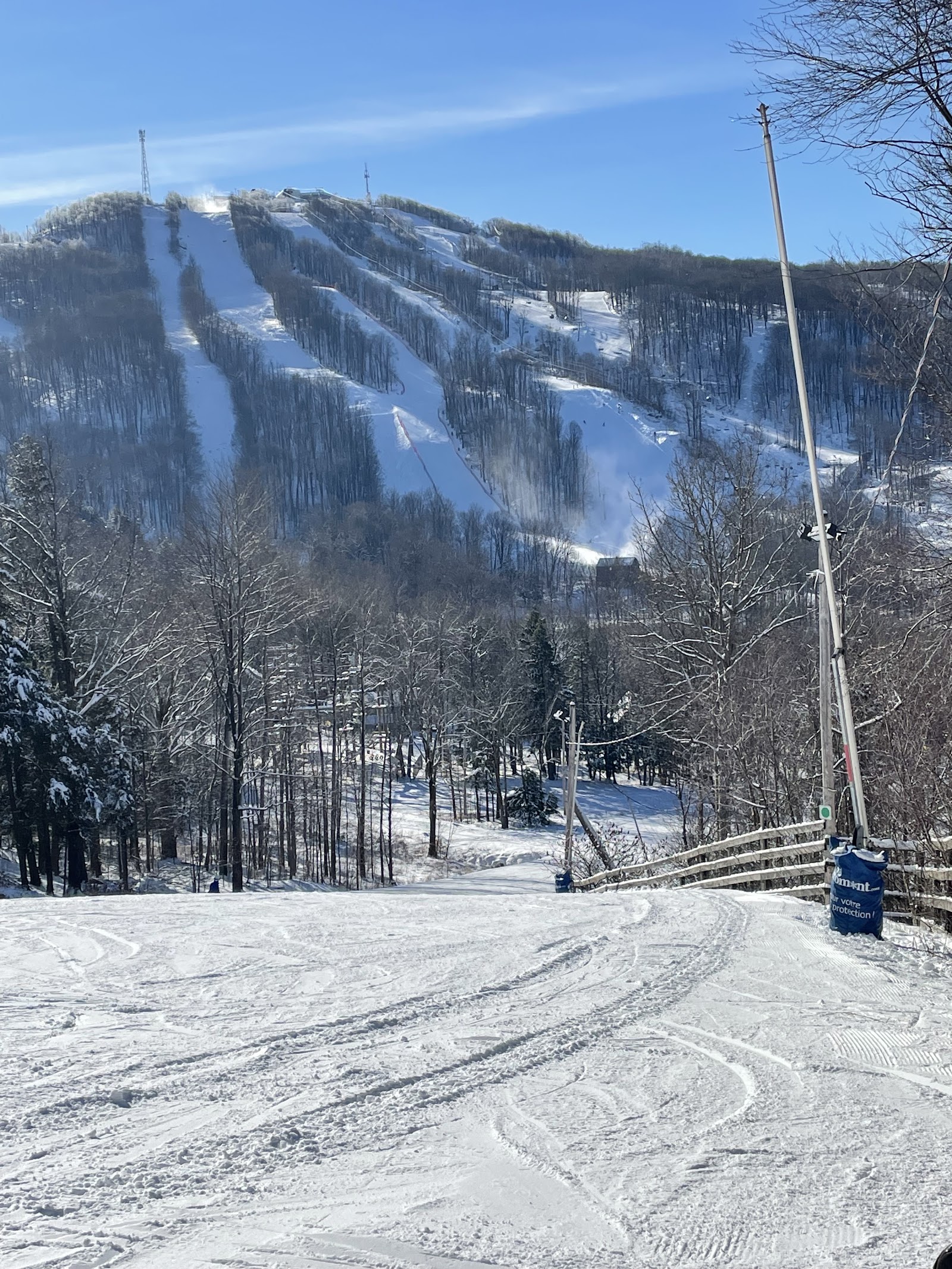 Chairlift rising over forested slopes in the Eastern Townships