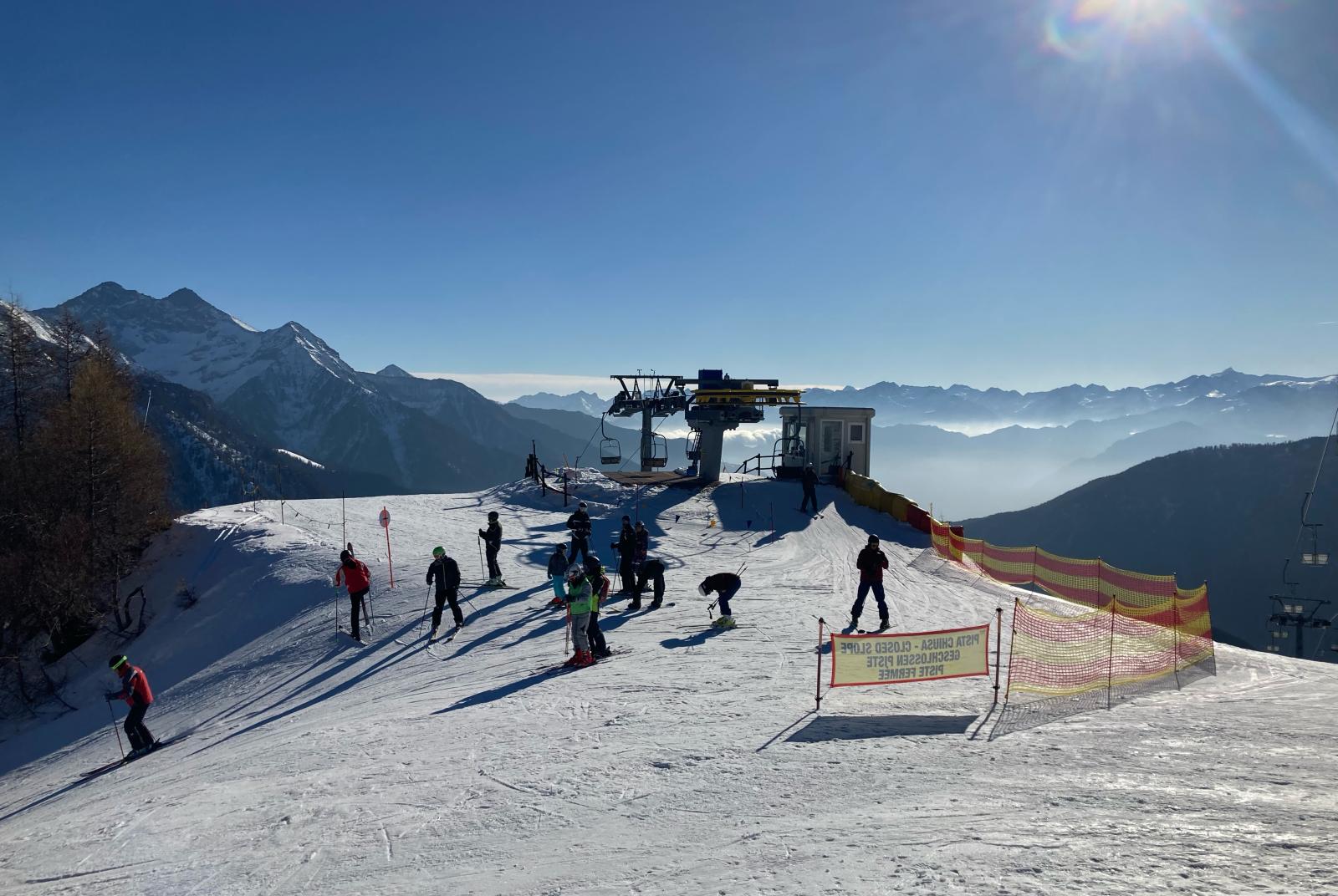 Children learning to ski on a gentle groomed slope