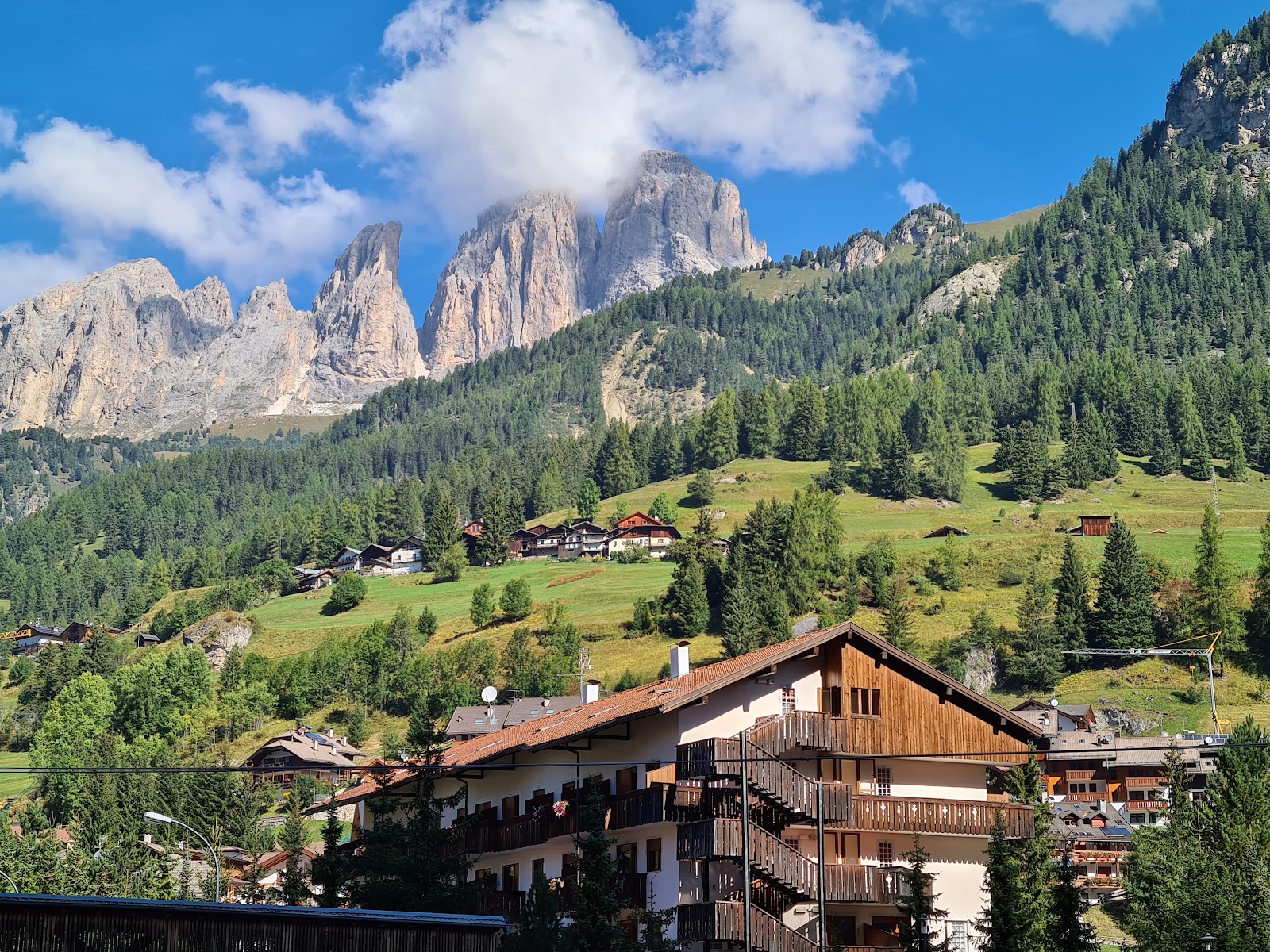 Snow covered Dolomites peaks framing the Val di Fassa