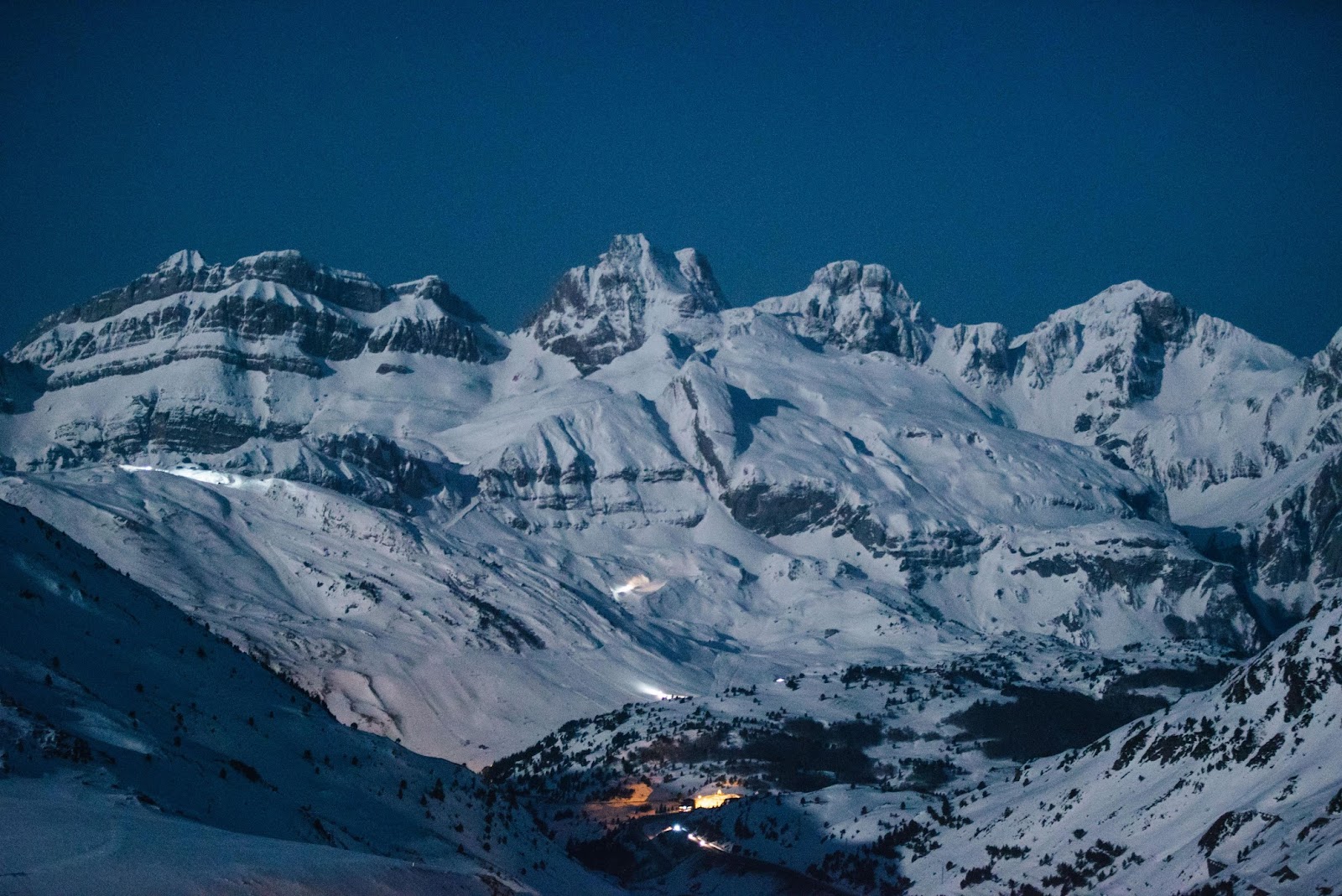 Snowy pistes and rocky peaks above Candanchu in the Aragon Pyrenees of Spain