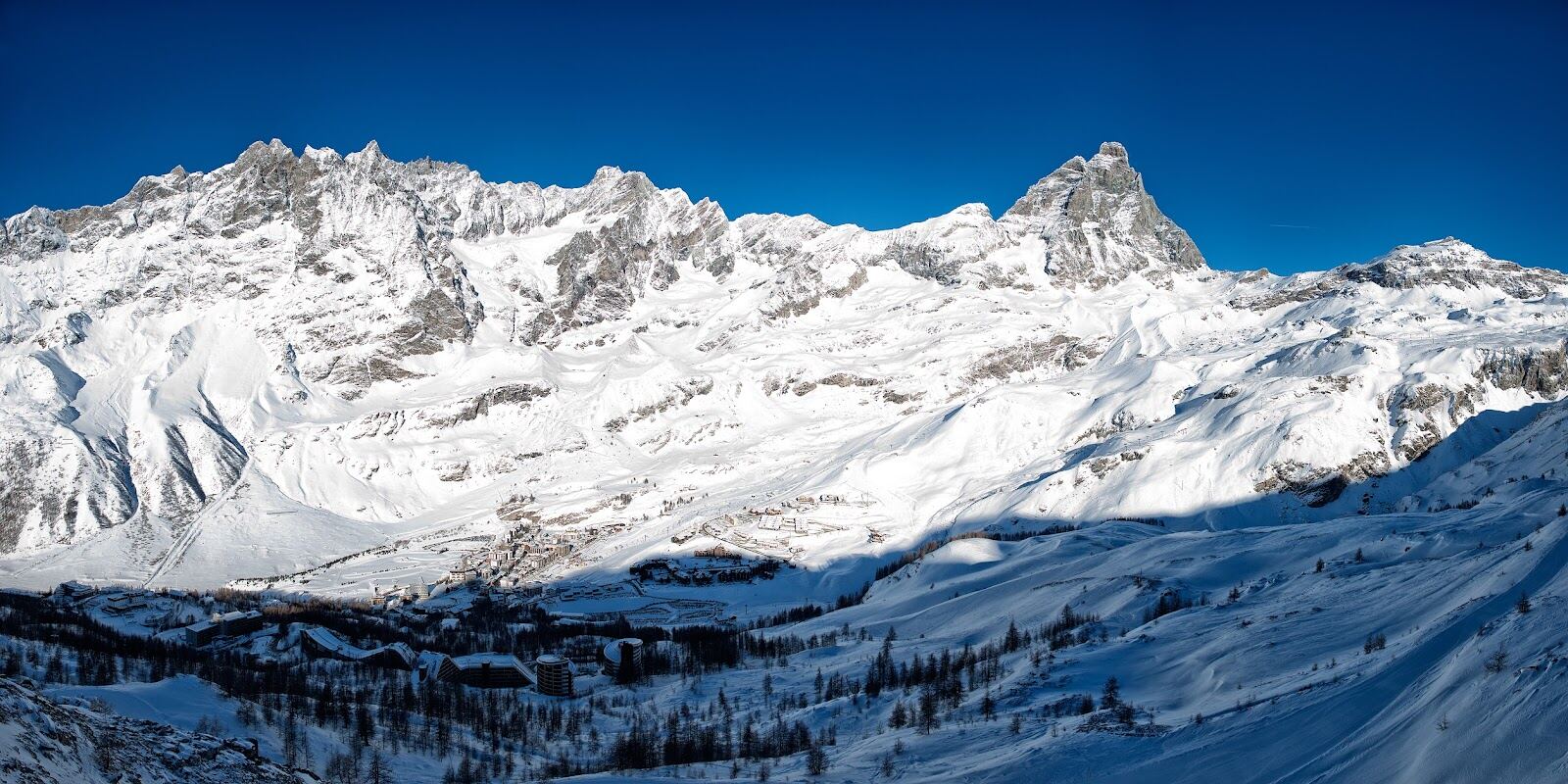 The Matterhorn rising above the sunny high altitude pistes of Cervinia in Italy