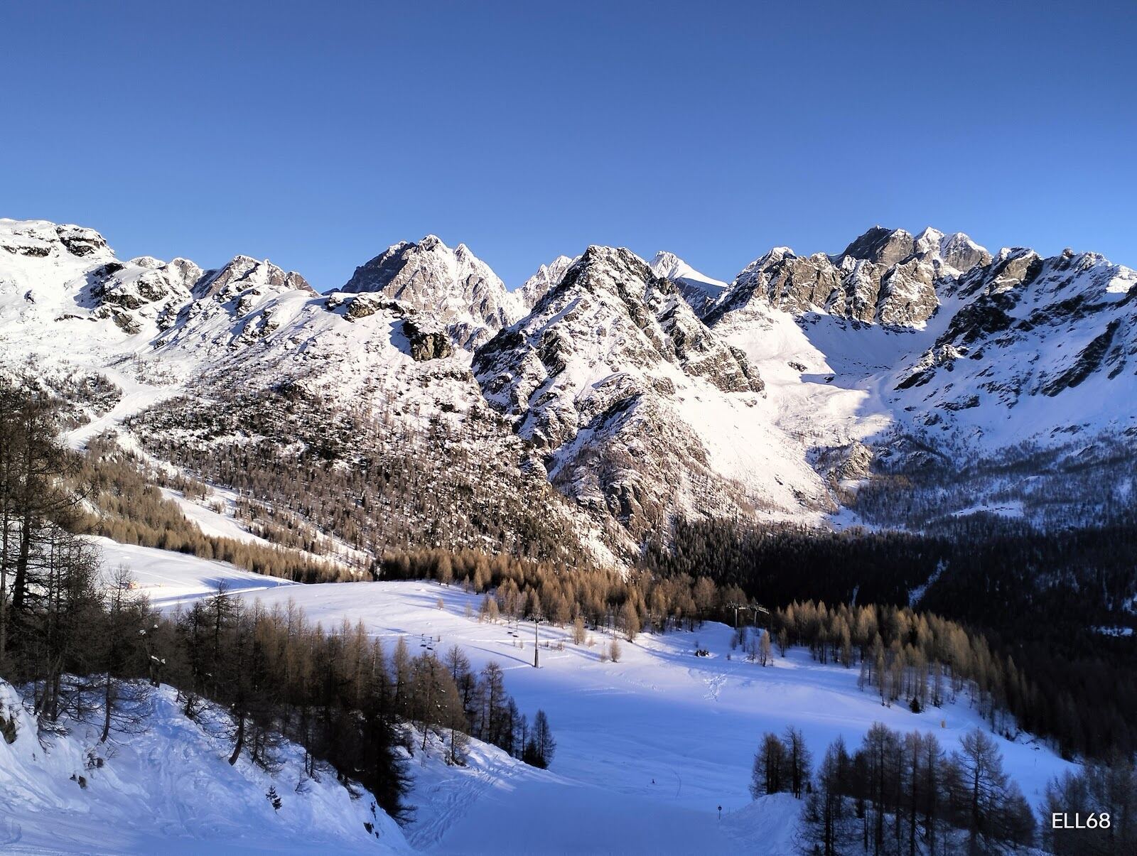 The high Bernina peaks rising above the valley in winter