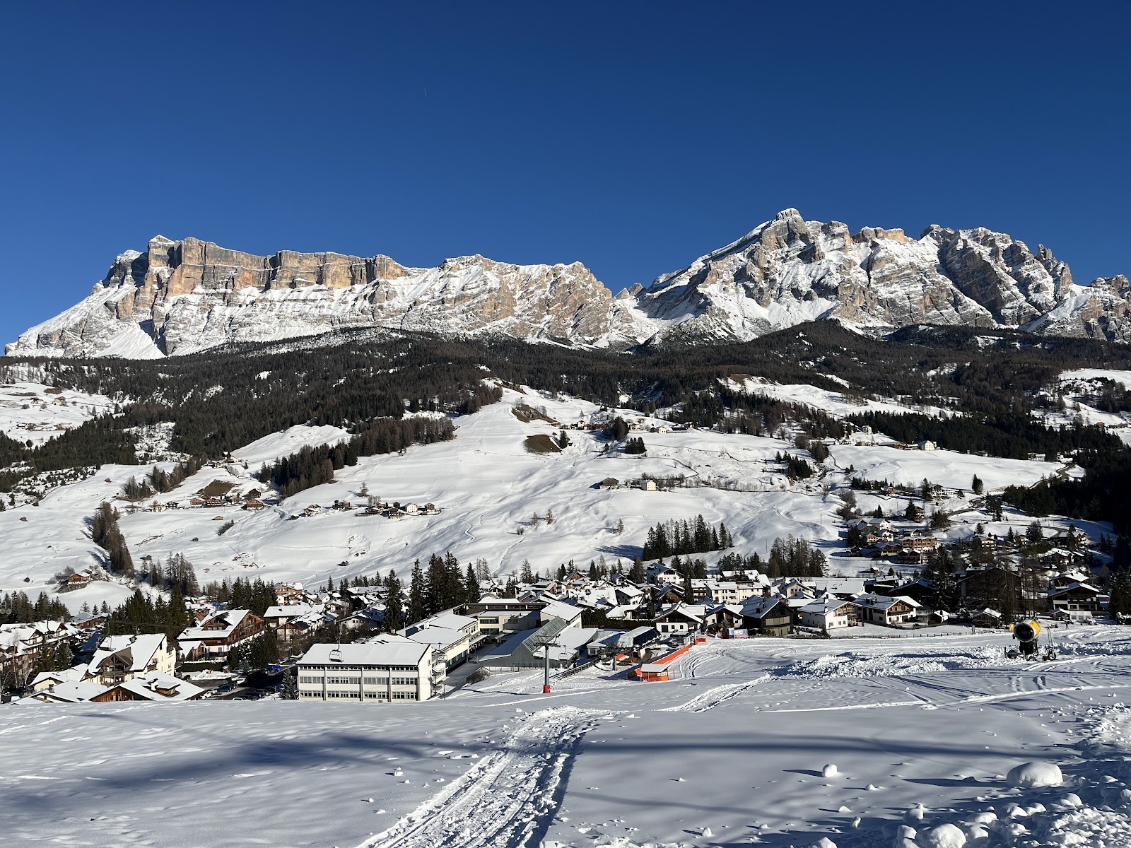 The quiet village of Colfosco in the Dolomites under winter snow