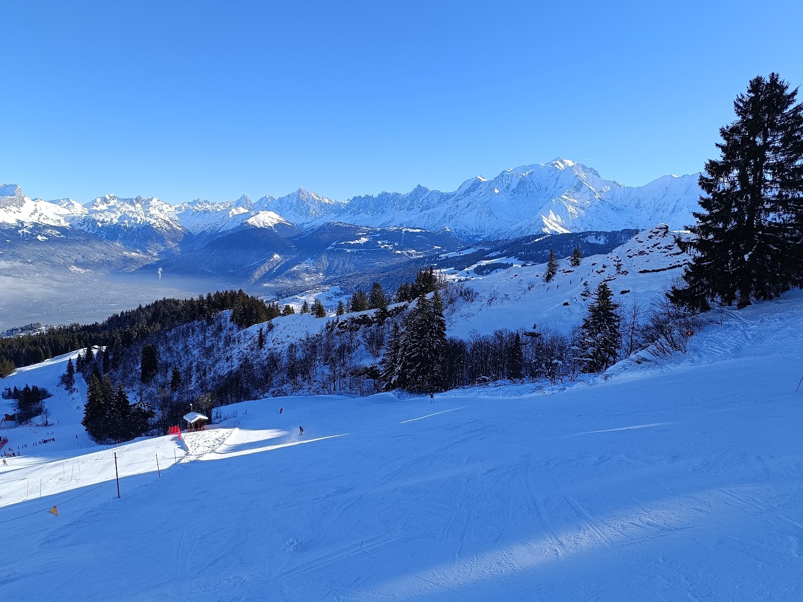 The village of Combloux under snow with Mont Blanc rising behind