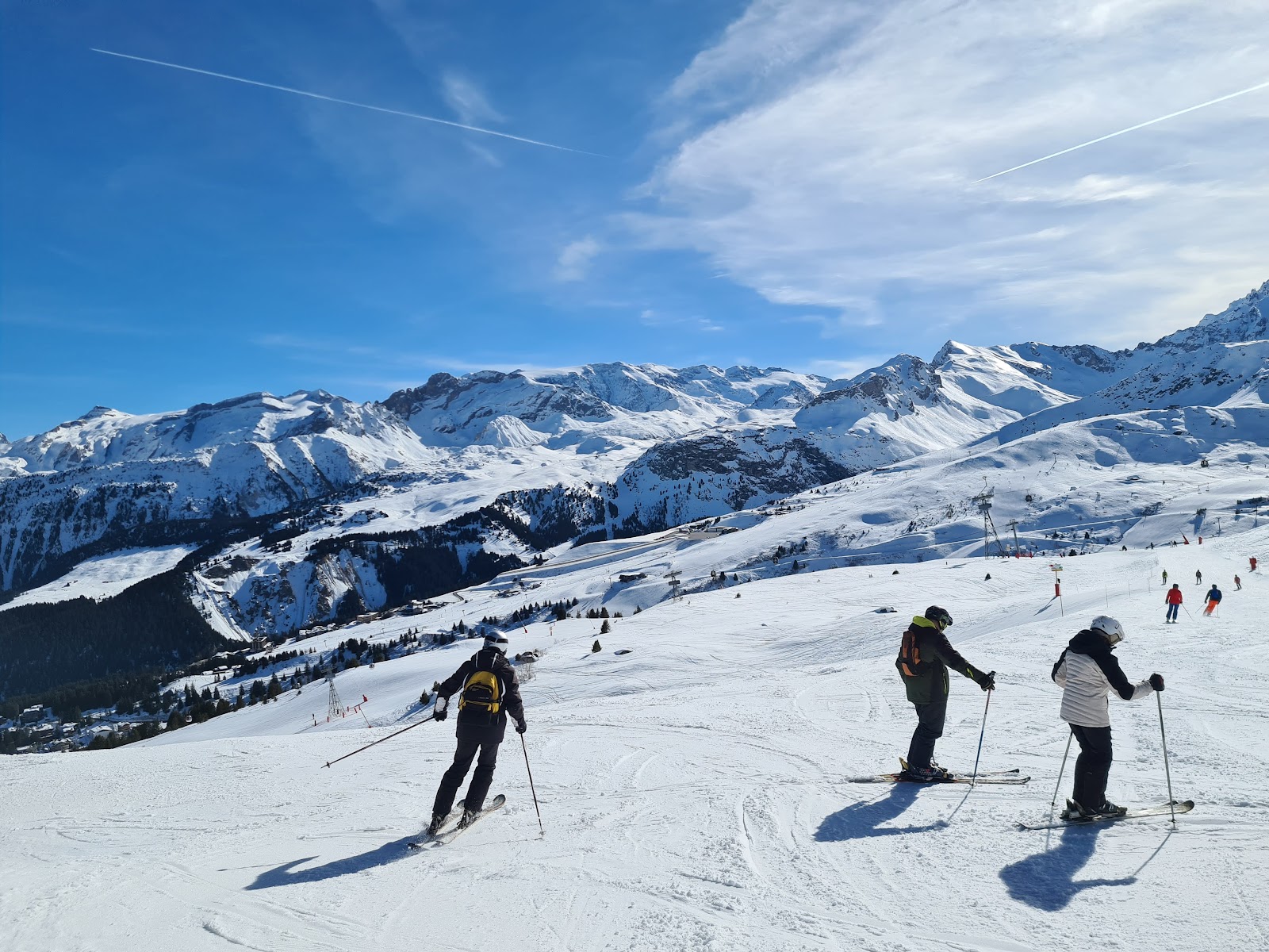 Skiers on the slopes above the Three Valleys