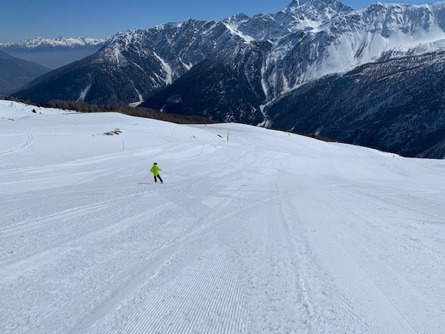 Snowy Aosta Valley peaks under blue winter sky