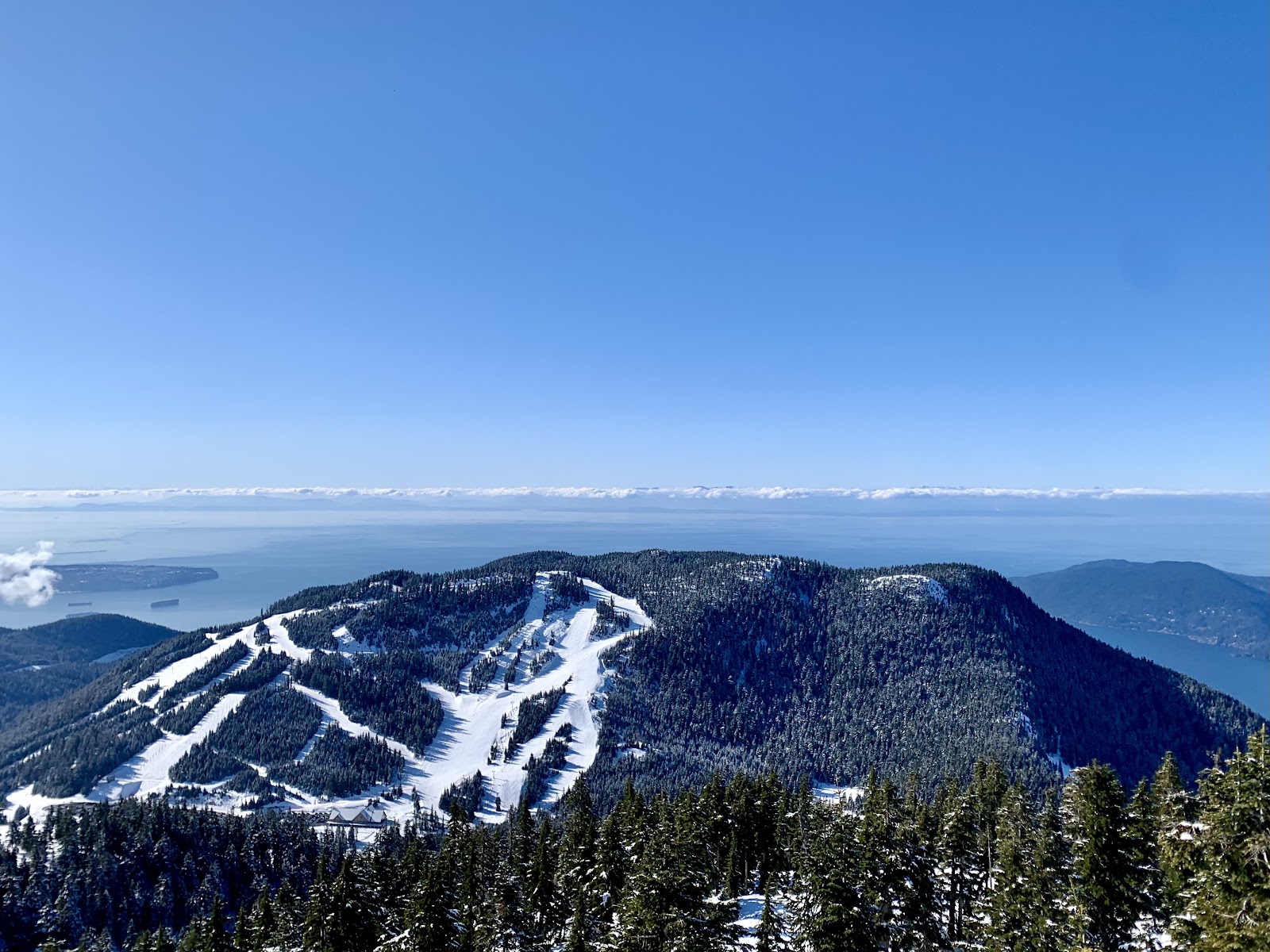 Skiers and snowboarders on a run at Cypress Mountain