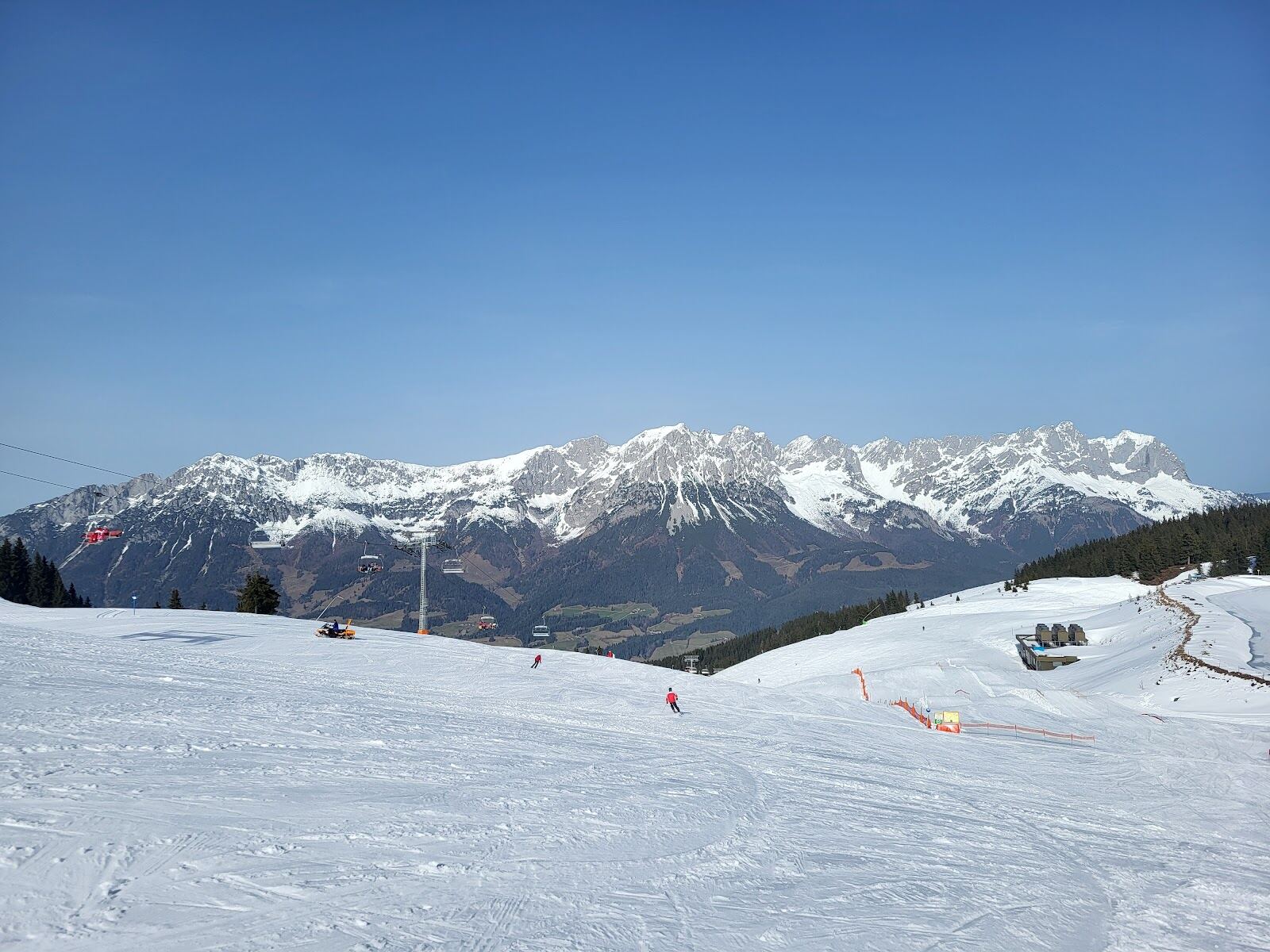 Snow covered chalets and church of Ellmau