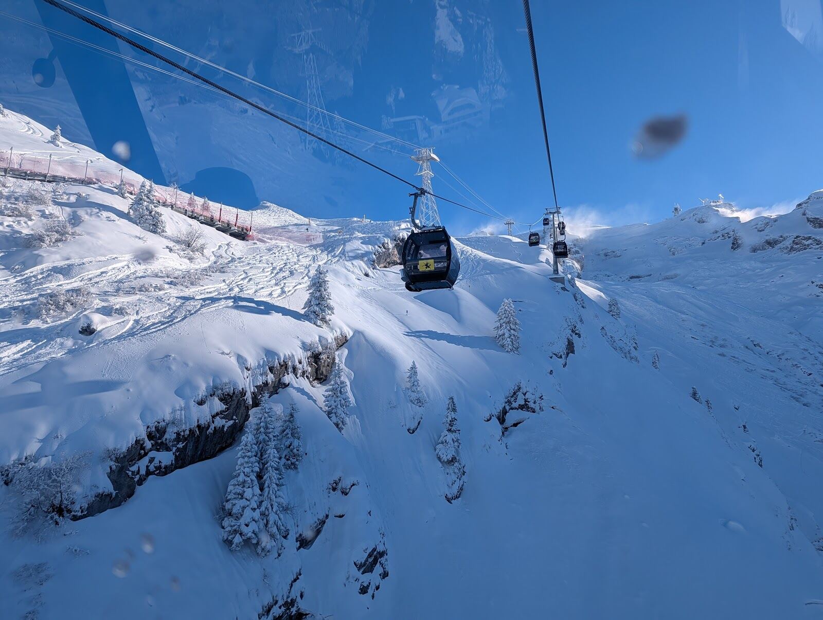 Skiers on the glacier slopes high above Engelberg
