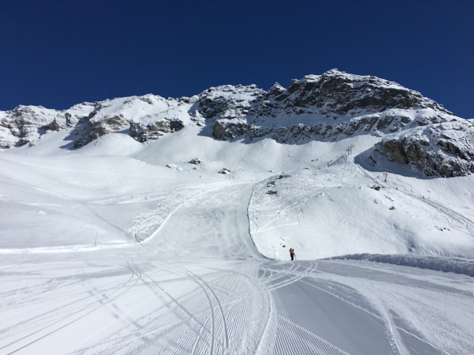 Sunny gentle pistes above Evolene with sweeping Valais mountain views