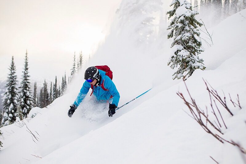 A timber ski lodge in deep snow at a Canadian mountain resort