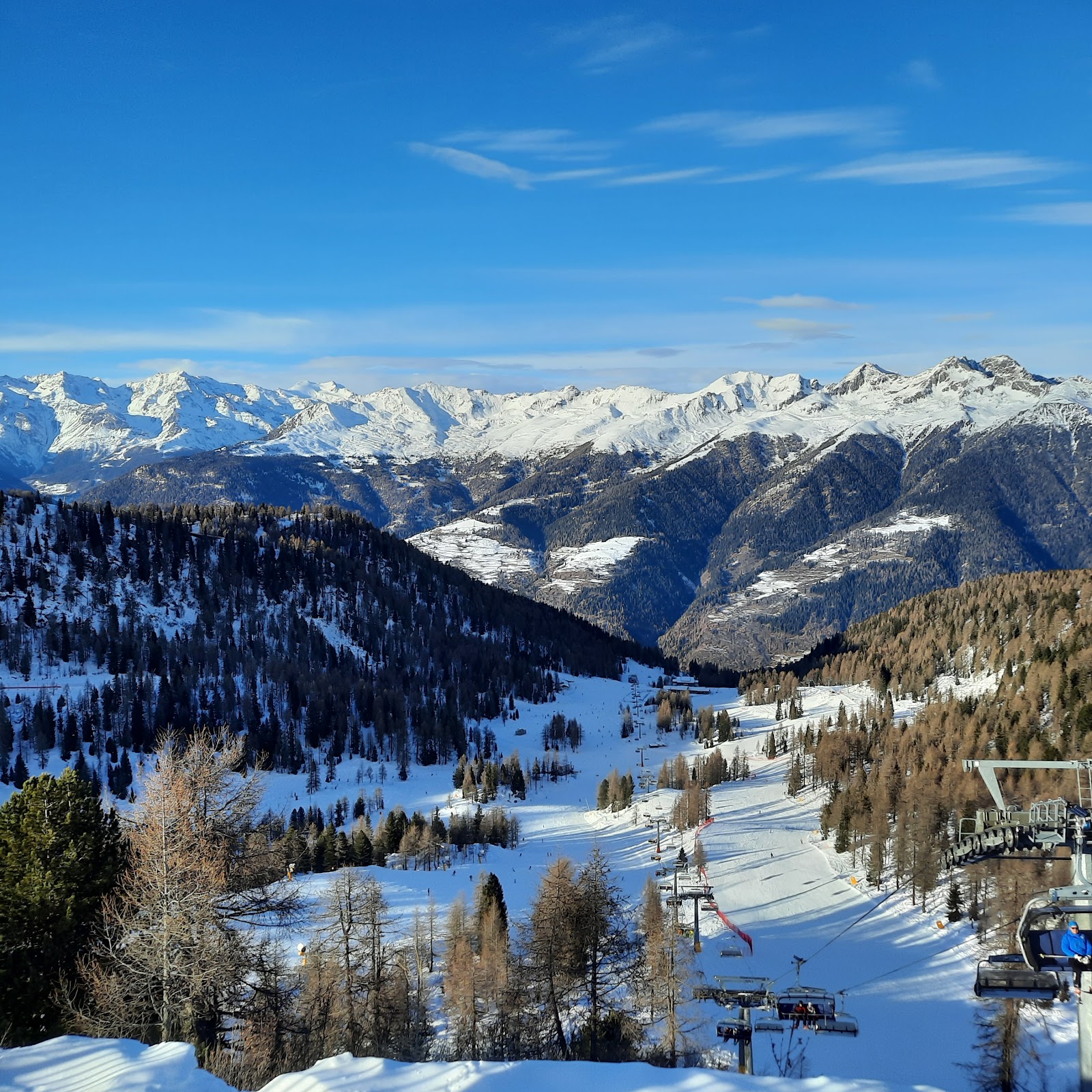 Well groomed blue pistes above Folgarida in winter