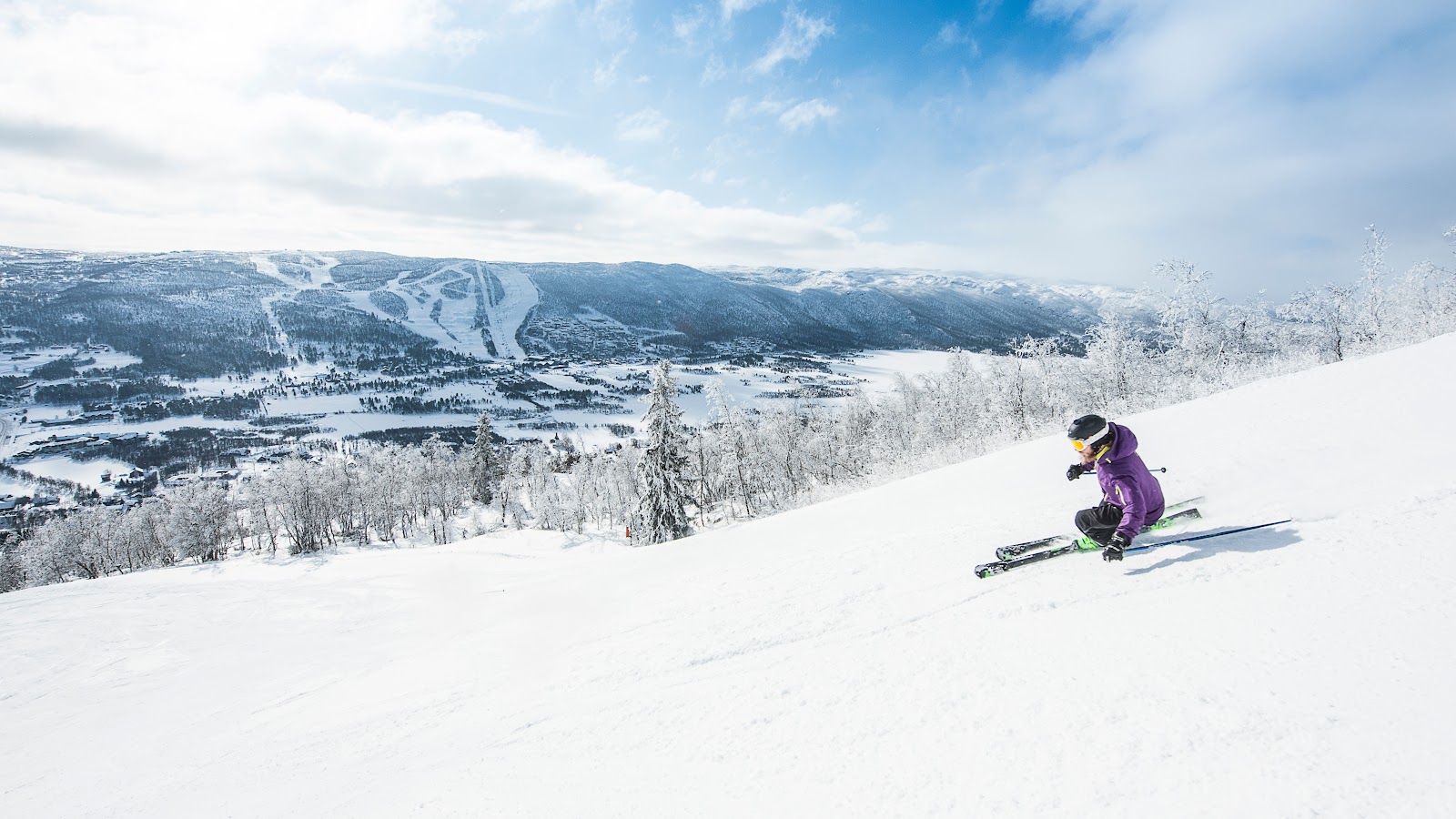 Gentle snowy slopes and the ski town of Geilo on the Bergen railway in Norway