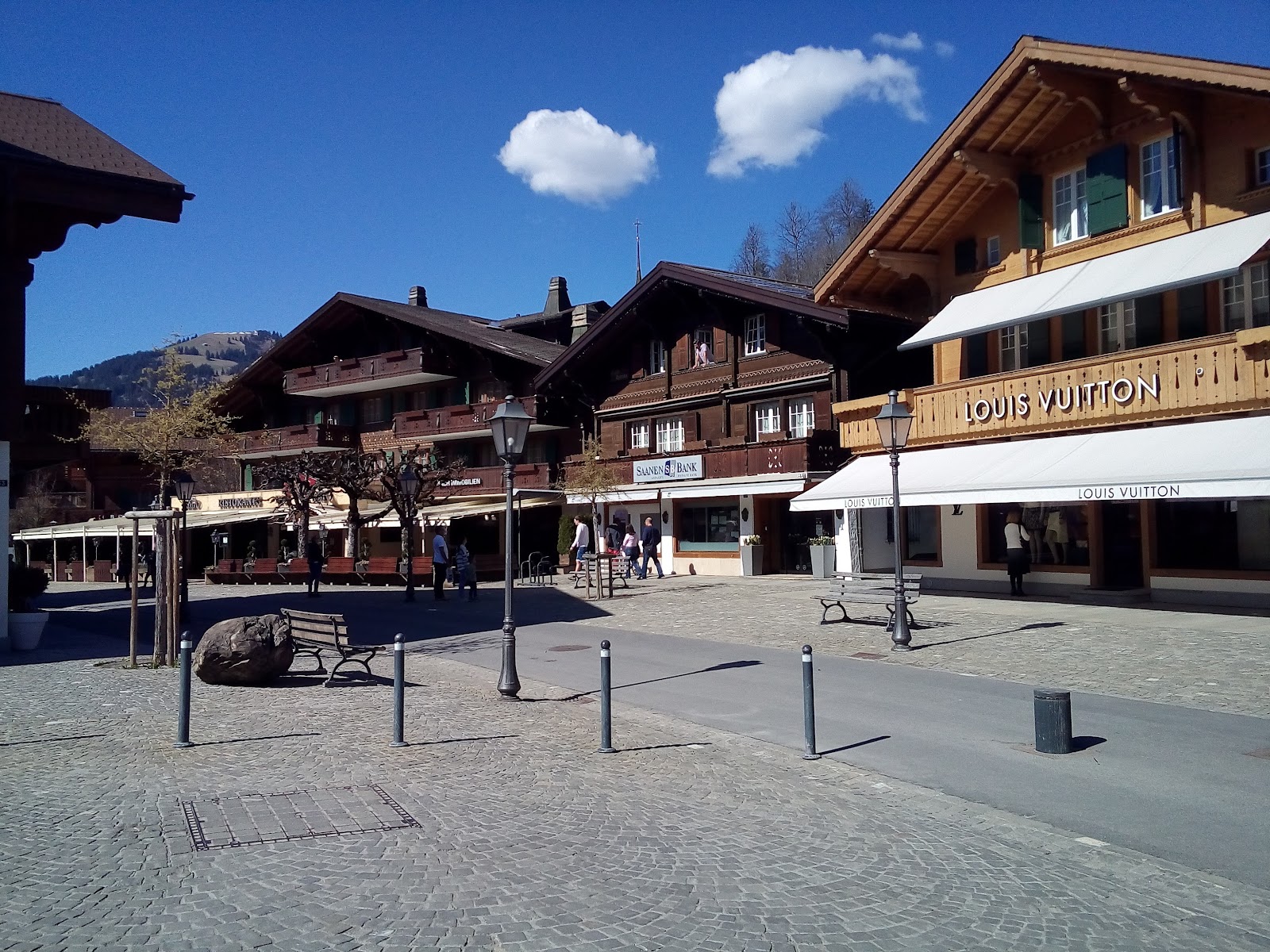The promenade of Gstaad lined with chalets under snow