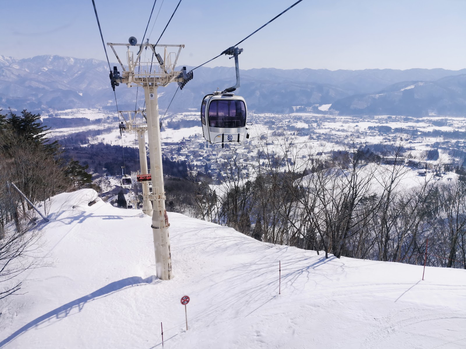 Steep groomed pitches descending Hakuba Happo One