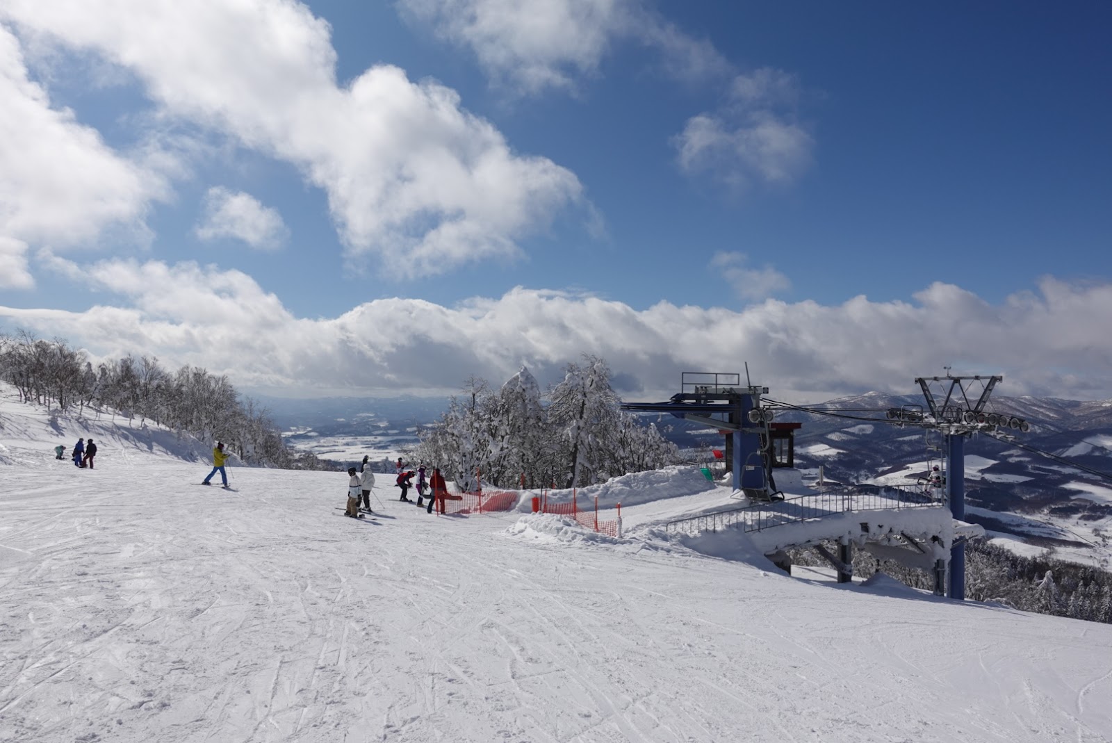 Snow laden forest and empty piste at Kamui Ski Links in central Hokkaido