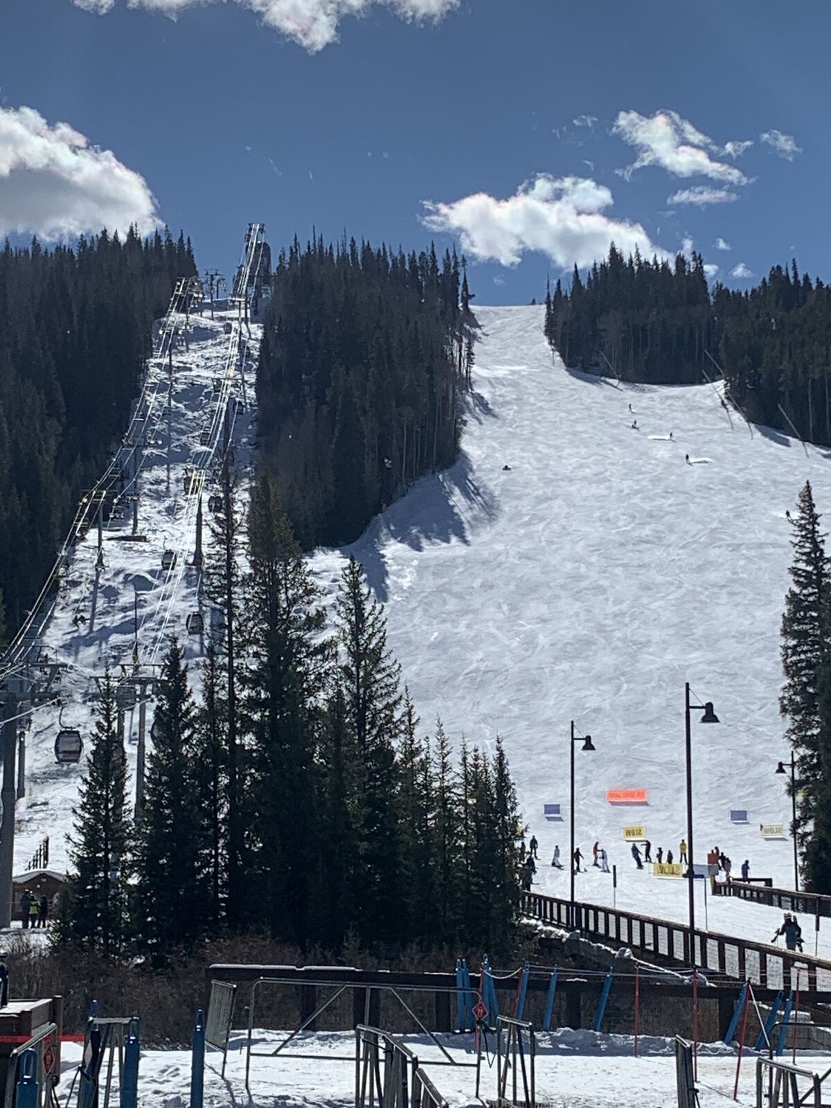 Floodlit night skiing slopes glowing after dark at Keystone
