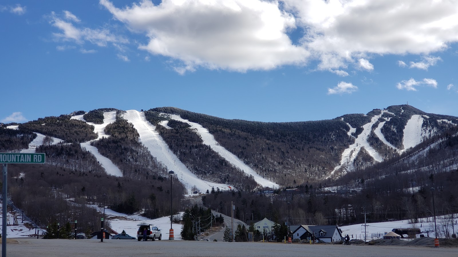 Wide snow making fed pistes across the spread out peaks of Killington in Vermont