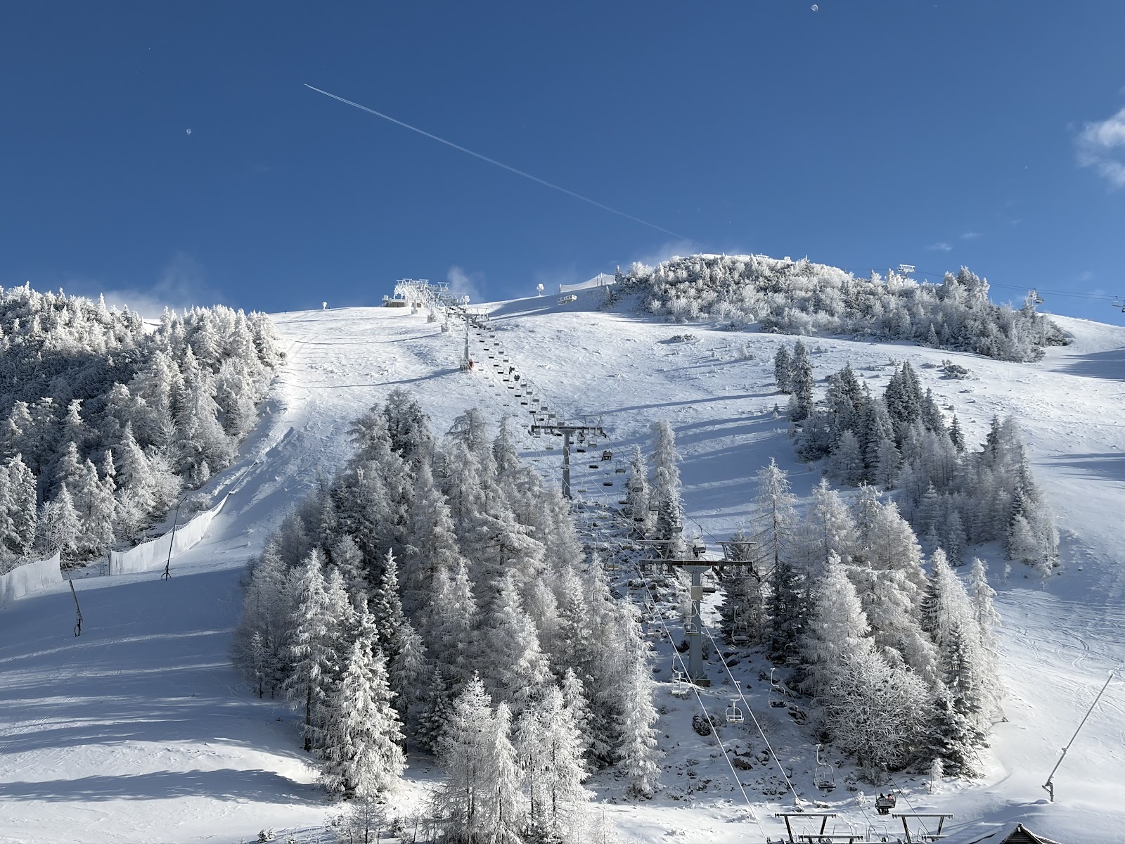 Sunny high plateau pistes above the gondola at Krvavec in Slovenia