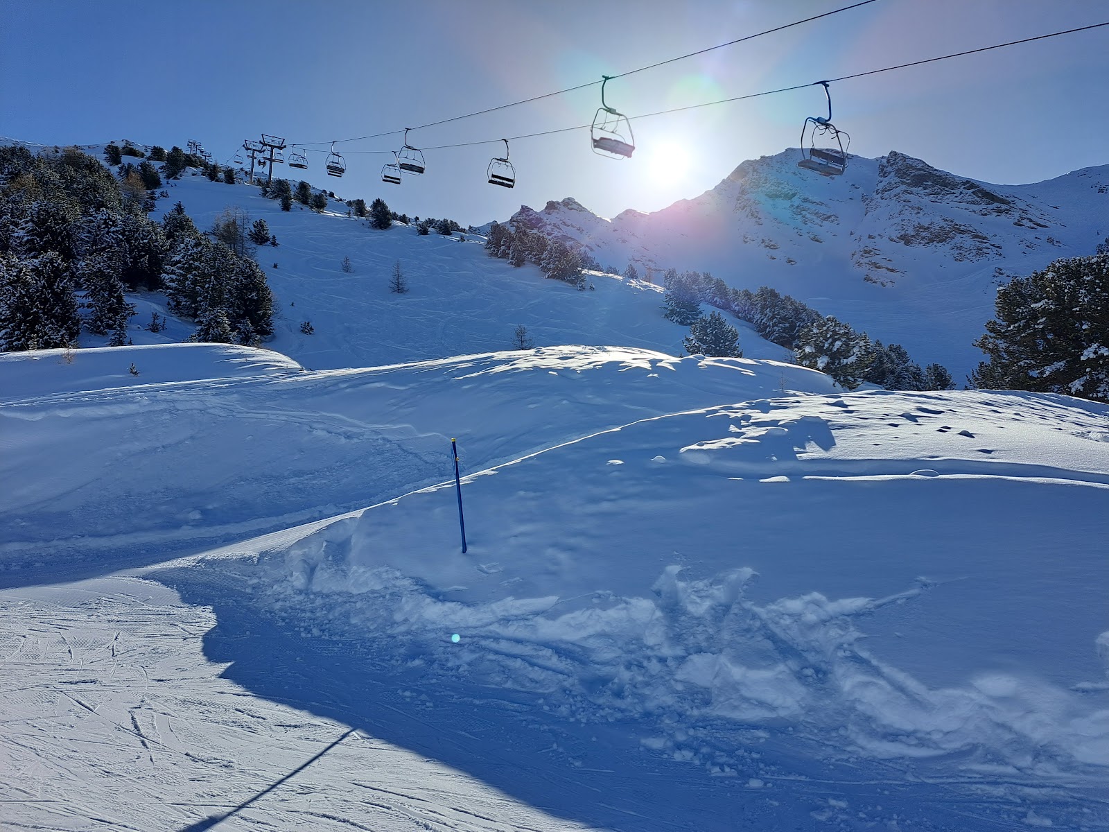 Skiers on wide easy slopes above La Norma in the Maurienne