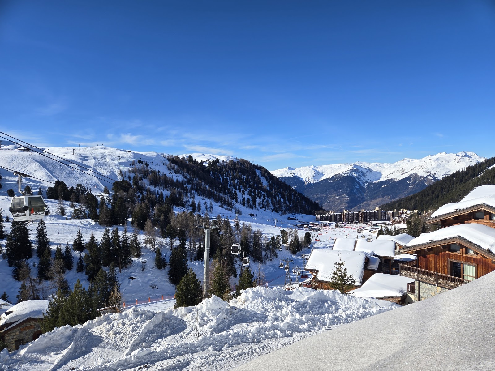 Wide intermediate pistes above the La Plagne centers on a clear day
