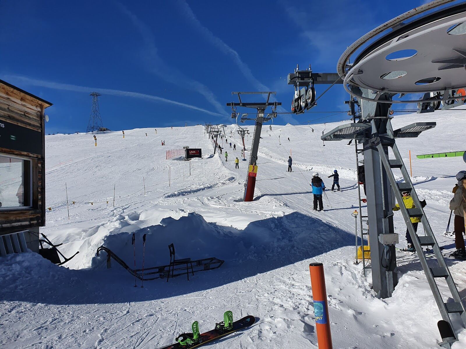 Skiers on the high Vorab glacier above Laax in spring sun