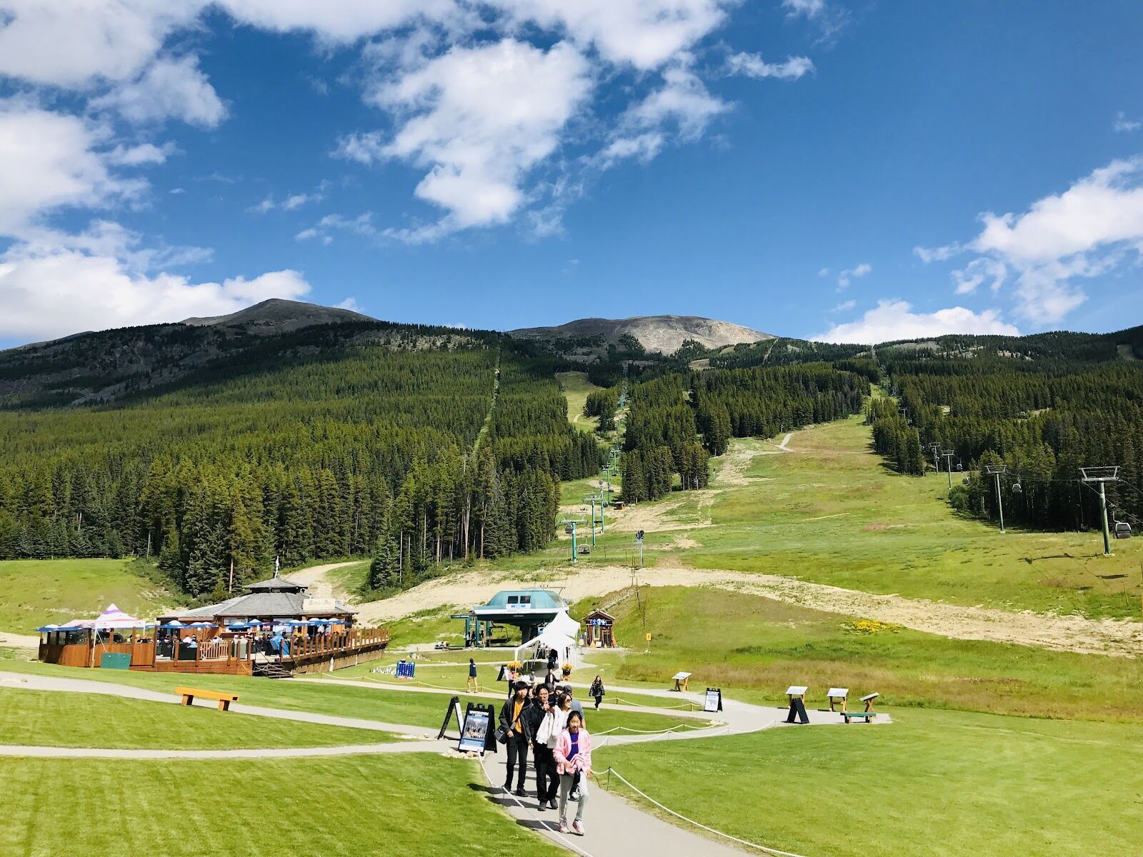 Snowy base area and chairlift framed by Rockies peaks at Lake Louise