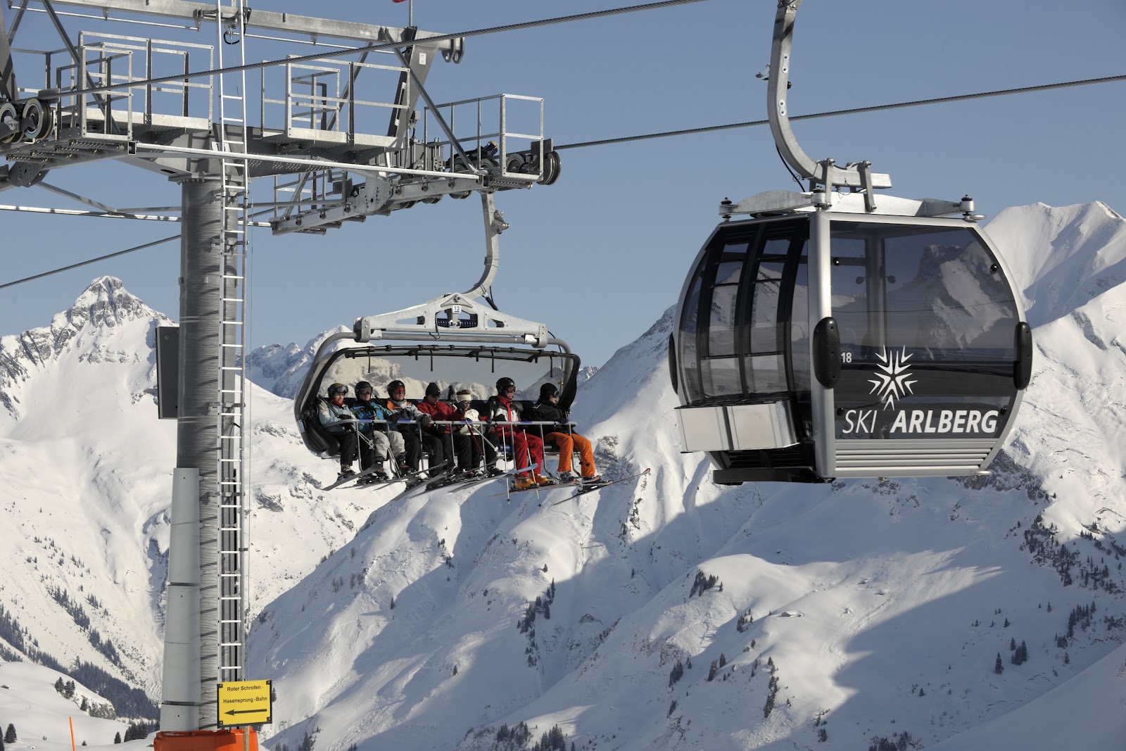 Snowy Arlberg peaks and a cable car above Lech and Zurs
