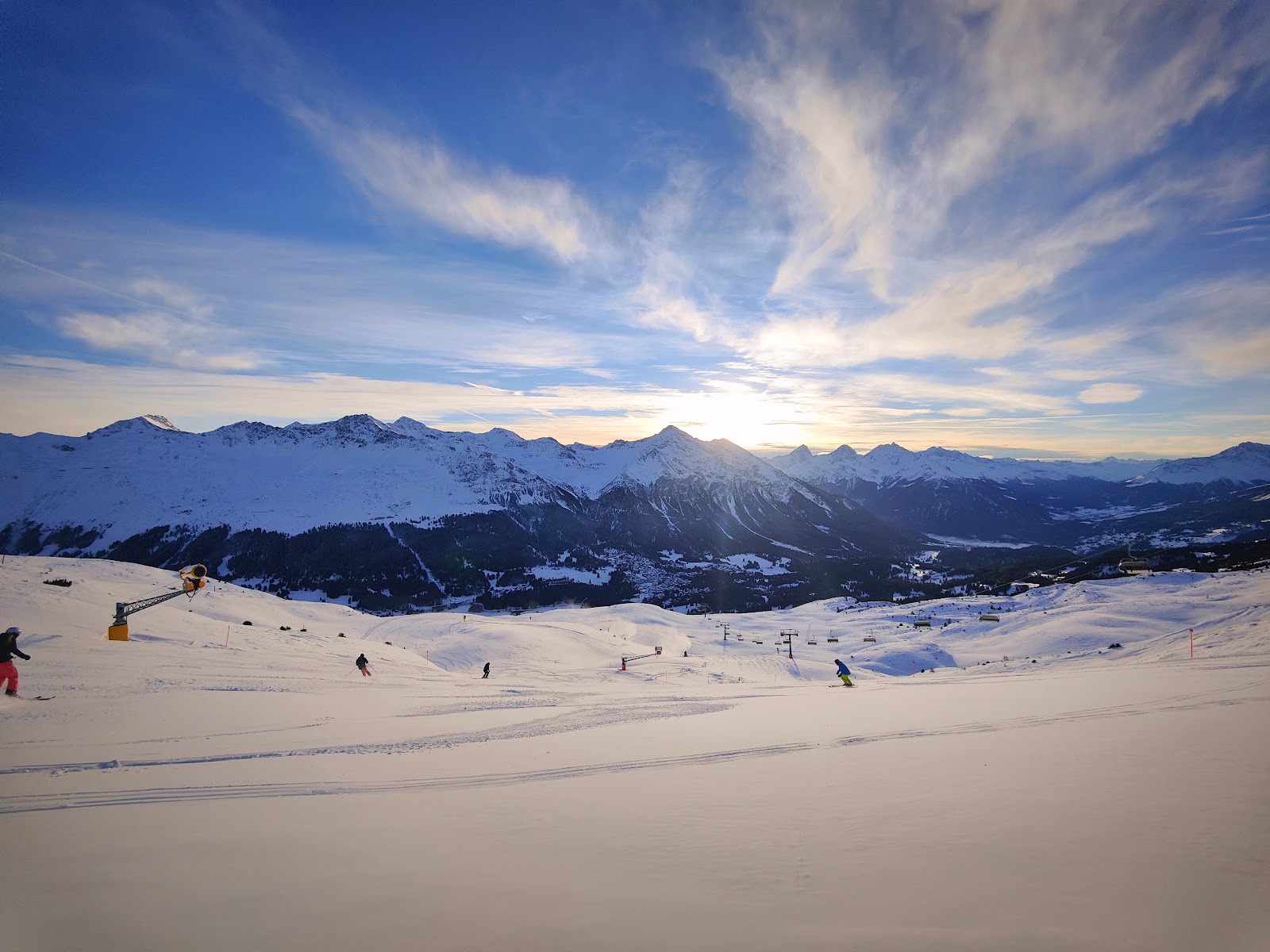 Skiers on the linked Arosa Lenzerheide slopes on a clear day