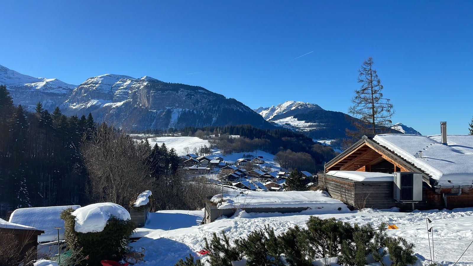 Chalets and the village centre of Les Carroz under snow