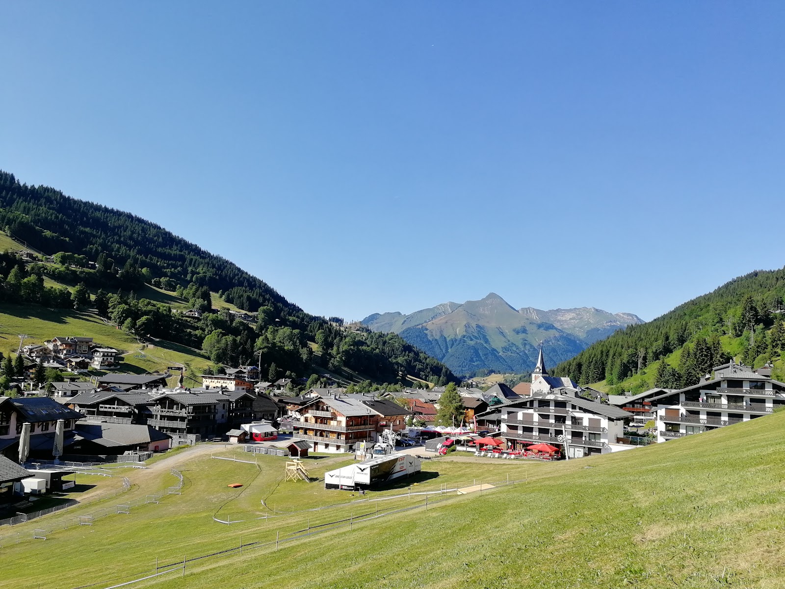 A gondola rising from the village toward the slopes