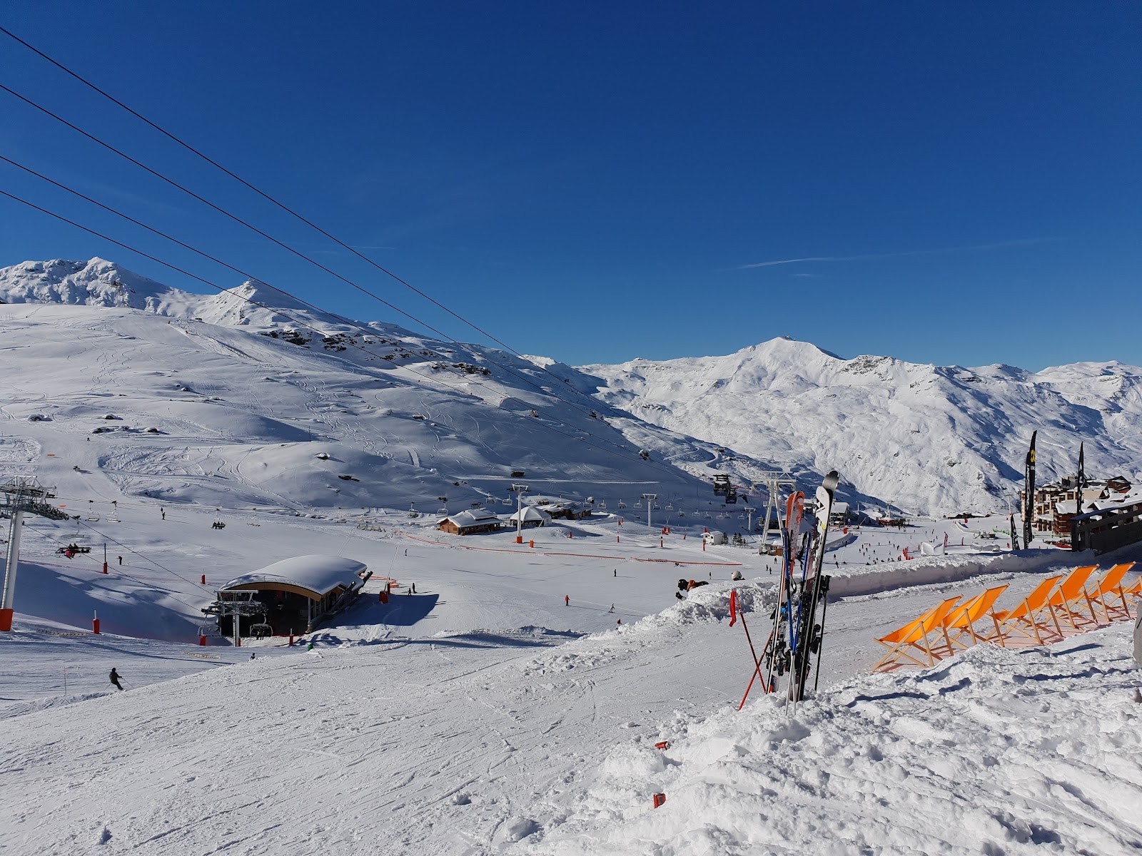 Wide pistes of the Three Valleys above Les Menuires on a clear day