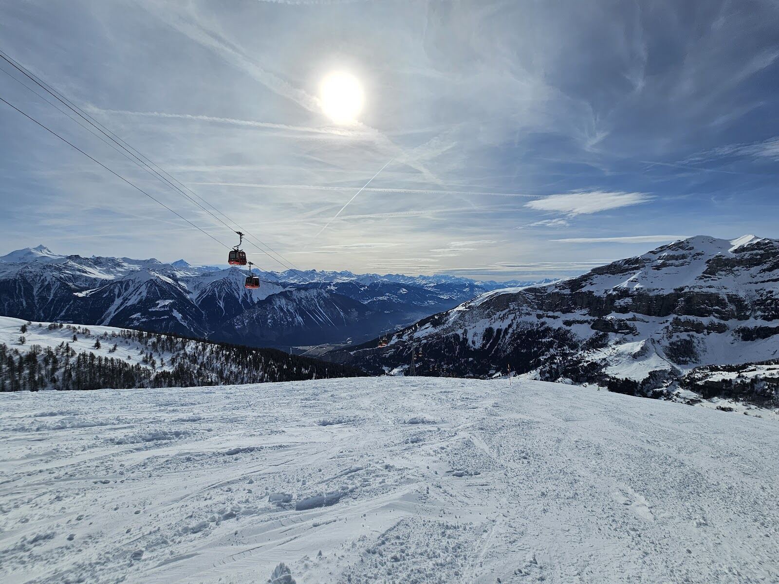 Skiers on a quiet run with Valais views above Leukerbad
