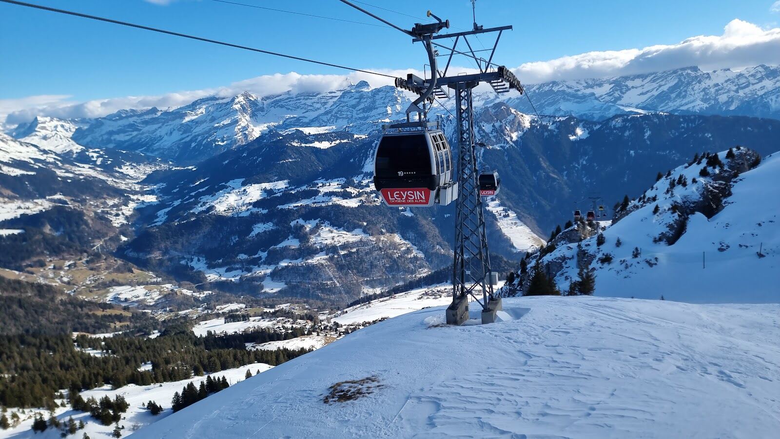 The terrace village of Leysin under winter sun above Lake Geneva