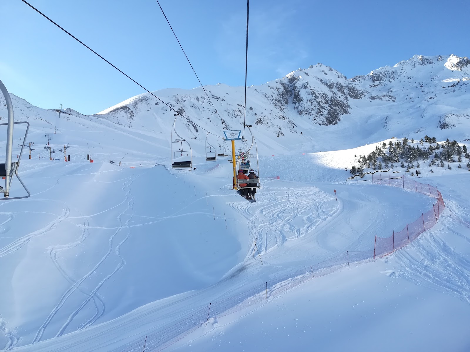 Open pistes of Luz Ardiden below the high Pyrenean peaks